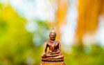 gold buddha statue during daytime