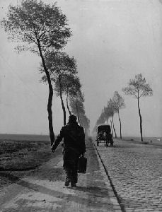 A displaced person returning home from a German prison camp.