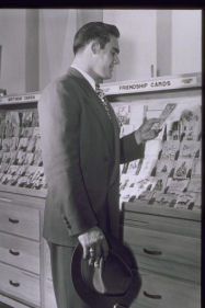 Man looking at greeting cards