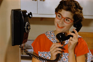 Woman talking on rotary phone ca. 1960